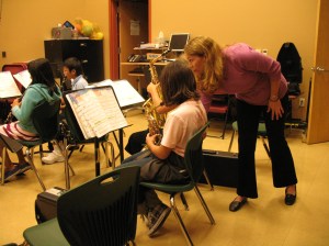 Music Teacher Chris Immesoete Helping Student Musicians