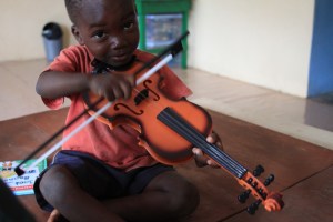 Happy Kids child playing a violin