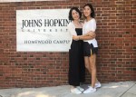 photo with mom in front of the jhu campus